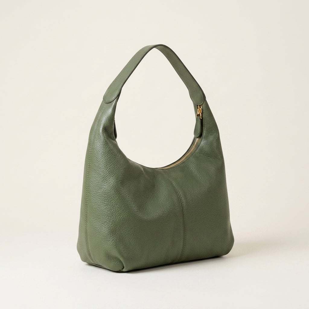 Green handbag on a light beige background