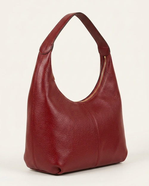 Red handbag on a white background
